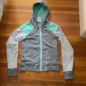 Ivivva long sleeve zip up with a hood.